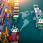 Aerial top view containers ship cargo business commercial trade logistic and transportation of international import export by container freight cargo ship with on worldmap